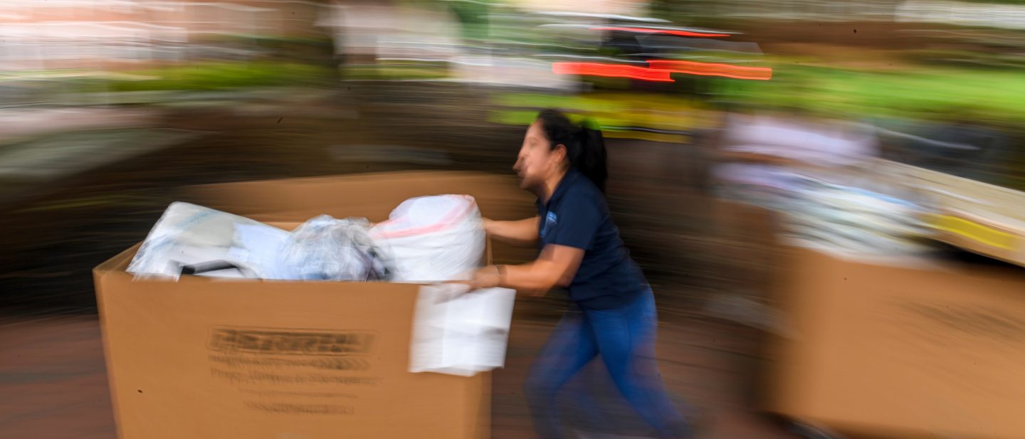 Person pushing cart during 2024 move-in.