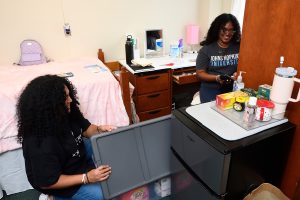 Roommates unpacking during 2024 move-in.