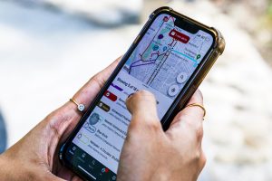 Person using the TransLoc app on a smartphone.