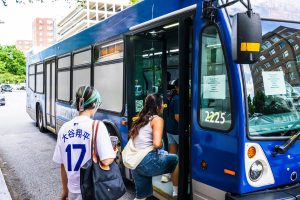 Students using the JHU shuttle bus.