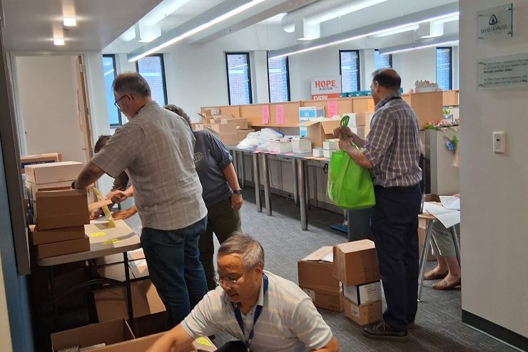 People packing boxes at the 2025 lab supply swap.
