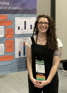 Lindi Shepard presenting a research poster. 